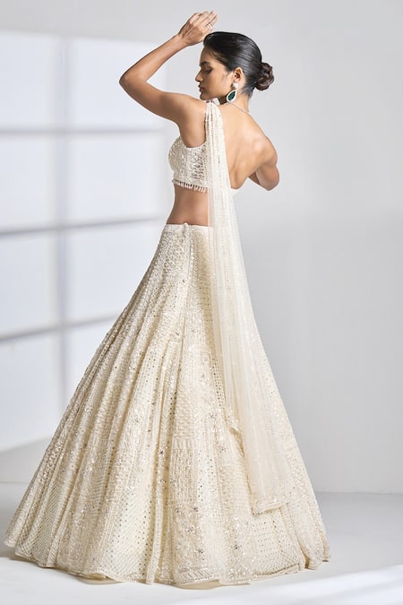 Buy Seema Gujral Ivory Net Pearl, Sequin And Beads One Shoulder Blouse & Lehenga Set Online at Aza Fashions Buy_Seema Gujral_Ivory Net Pearl, Sequin And Beads One Shoulder Blouse & Lehenga Set _Online_at_Aza_Fashions