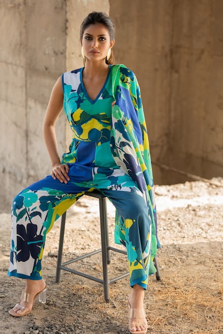 Pooja-Keyur_Blue Cotton Satin V-neck Abstract Paradise Print Jumpsuit_at_Aza_Fashions