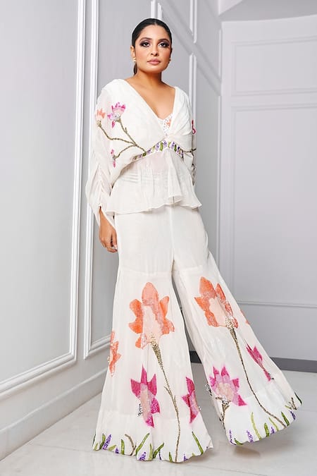 Amrta By Guneet Kondal White Viscose Sequins, Pearls V-neck Embroidered Peplum Top And Sharara Set Online at Aza Fashions Amrta By Guneet Kondal_White Viscose Sequins, Pearls V-neck Embroidered Peplum Top And Sharara Set _Online_at_Aza_Fashions