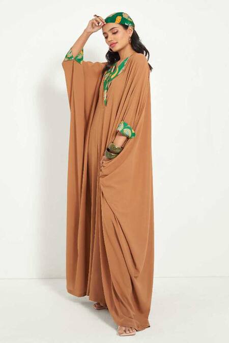 Style Junkiie Beige Crepe Embroidery Halter Neck Flared Jumpsuit at Aza Fashions Style Junkiie_Beige Crepe Embroidery Halter Neck Flared Jumpsuit _at_Aza_Fashions