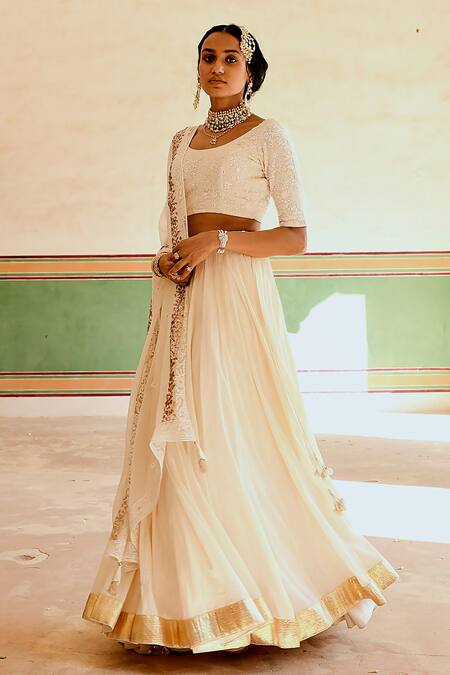 Karaj Jaipur_Cream Georgette, Cotton, Crepe Embroidery, Tassels Round Neck Blouse Lehenga Set _at_Aza_Fashions