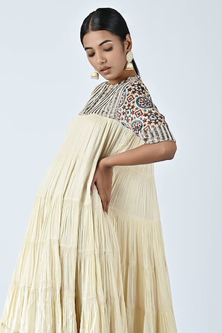Sejal Kamdar_Beige Crepe, Satin Zari, Embroidery Round Neck Yoke Tiered Dress _Online_at_Aza_Fashions