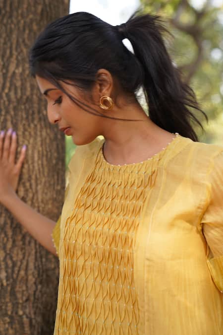 Buy_Dhaari_Yellow Handloom Cotton, Silk Tassels, Lace Round Neck Hand Smocked Dress _Online_at_Aza_Fashions