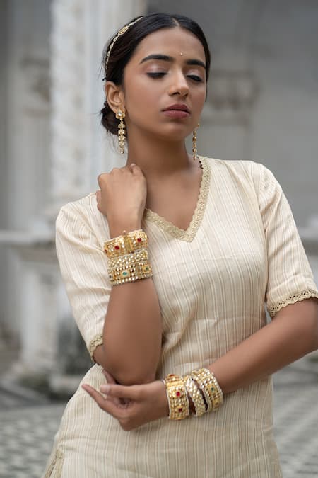 Sheela Suthar Ivory Chanderi, Tissue Zari, Diamonds V-neck Stripe Pattern Kurta Gharara Set Online at Aza Fashions Sheela Suthar_Ivory Chanderi, Tissue Zari, Diamonds V-neck Stripe Pattern Kurta Gharara Set _Online_at_Aza_Fashions