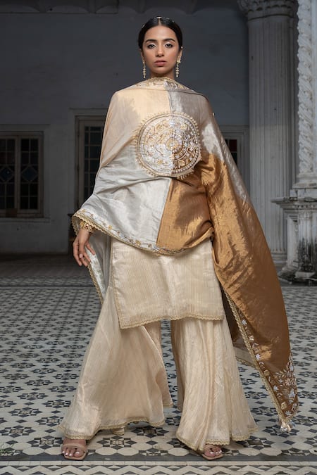 Shop Sheela Suthar Ivory Chanderi, Tissue Zari, Diamonds V-neck Stripe Pattern Kurta Gharara Set Online at Aza Fashions Shop_Sheela Suthar_Ivory Chanderi, Tissue Zari, Diamonds V-neck Stripe Pattern Kurta Gharara Set _Online_at_Aza_Fashions