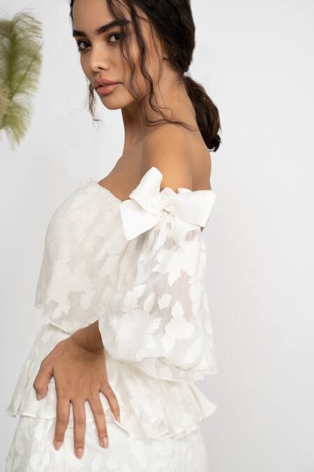 Amrta By Guneet Kondal Ivory Georgette, Viscose Smocking One Shoulder Tiered Off Mini Dress at Aza Fashions Amrta By Guneet Kondal_Ivory Georgette, Viscose Smocking One Shoulder Tiered Off Mini Dress _at_Aza_Fashions