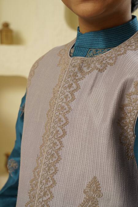 Rar Studio - Kids_Blue Chanderi, Cotton Tassels, Embroidery Quilted Dori Jacket Kurta Set_at_Aza_Fashions