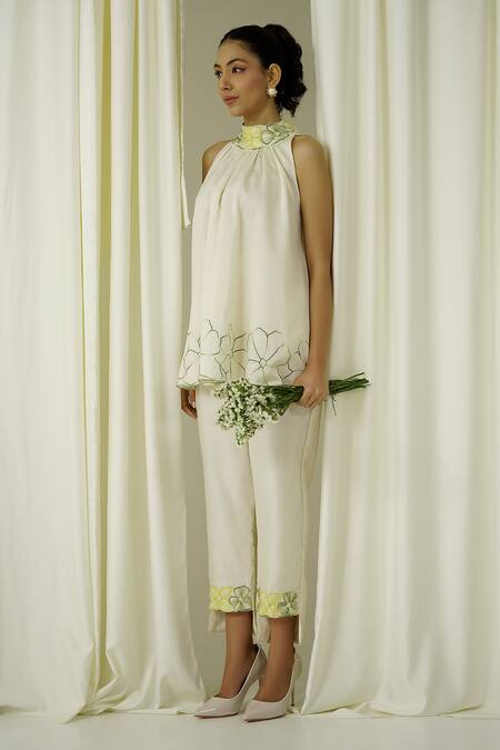 Shop Sakshi Khetterpal Ivory Chanderi Pearls, Beads, Embroidery Halter Neck Top And Pant Set Online at Aza Fashions Shop_Sakshi Khetterpal_Ivory Chanderi Pearls, Beads, Embroidery Halter Neck Top And Pant Set _Online_at_Aza_Fashions
