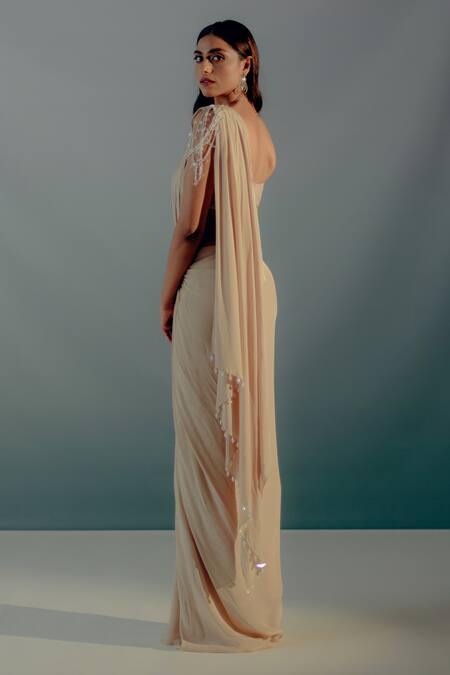 Aaryaa By Kashveen Kohli_Beige Crepe, Chiffon Crystals Sweetheart Tasselled Pre-draped Saree With Blouse _Online_at_Aza_Fashions