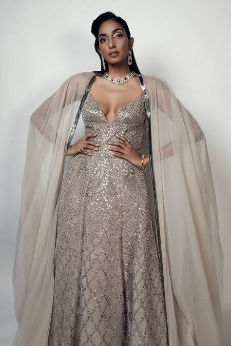 Rohit Gandhi + Rahul Khanna_Beige Tulle Crystals V-neck Spatial Metallic Gown With Cape _at_Aza_Fashions