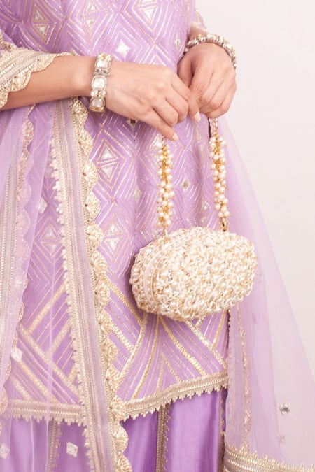 Forever Noor Beige Embellished Zuri Oval Shaped Clutch Online at Aza Fashions Forever Noor_Beige Embellished Zuri Oval Shaped Clutch _Online_at_Aza_Fashions