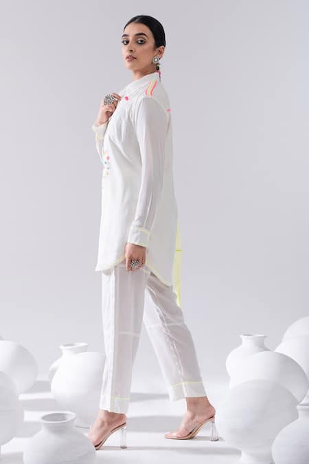 Shop Kacha Tanka Ivory Cotton Pom-poms Collared Thread Embroidered Short Kurta And Pant Set Online at Aza Fashions Shop_Kacha Tanka_Ivory Cotton Pom-poms Collared Thread Embroidered Short Kurta And Pant Set _Online_at_Aza_Fashions