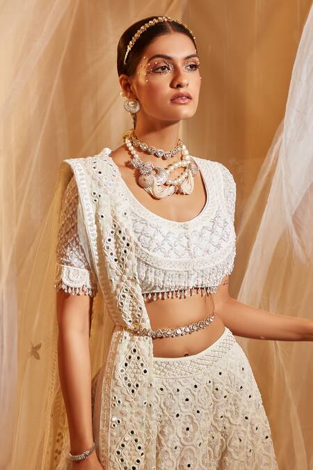 Shop House of Exotique Ivory Net Embroidery Round Neck Geometric Embellished Lehenga Set Online at Aza Fashions Shop_House of Exotique_Ivory Net Embroidery Round Neck Geometric Embellished Lehenga Set _Online_at_Aza_Fashions