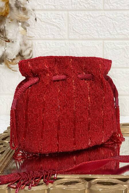 Kainiche By Mehak Red Embellished Tassel Fringe Border Potli Online at Aza Fashions Kainiche By Mehak_Red Embellished Tassel Fringe Border Potli _Online_at_Aza_Fashions