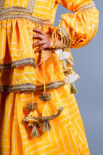 Buy_Shining Kanika_Yellow Crepe, Cotton Tassels Layered Lehenga Set _Online_at_Aza_Fashions