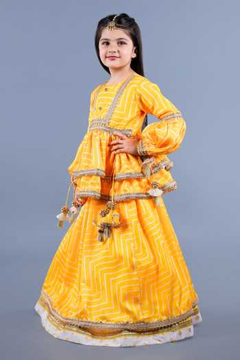 Shining Kanika_Yellow Crepe, Cotton Tassels Layered Lehenga Set _at_Aza_Fashions