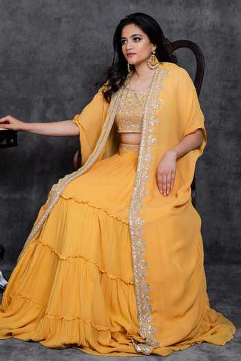 Sunita Bhandari_Yellow Viscose Gota Patti, Embroidery, Zari Placket Cape Tiered Lehenga Set _at_Aza_Fashions
