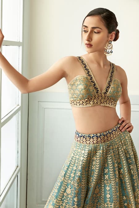 Studio Iris India Blue Organza Embroidery, Sequins Plunge Neck Morni Floral Pattern Lehenga Set at Aza Fashions Studio Iris India_Blue Organza Embroidery, Sequins Plunge Neck Morni Floral Pattern Lehenga Set _at_Aza_Fashions