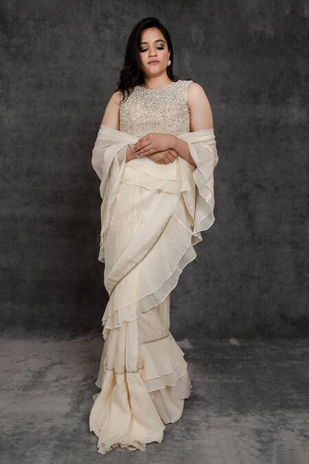 Sunita Bhandari Ivory Viscose, Organza, Net Ruffle Pre-draped Saree With Embroidered Blouse Online at Aza Fashions Sunita Bhandari_Ivory Viscose, Organza, Net Ruffle Pre-draped Saree With Embroidered Blouse _Online_at_Aza_Fashions