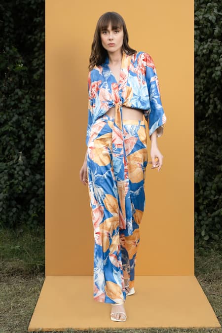 Mandira Wirk Resort_Blue Satin Hawaii Print V Neck Wrap Top And Bell Bottom Set_Online_at_Aza_Fashions
