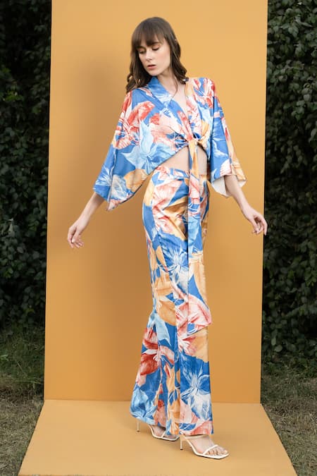 Shop_Mandira Wirk Resort_Blue Satin Hawaii Print V Neck Wrap Top And Bell Bottom Set_Online_at_Aza_Fashions