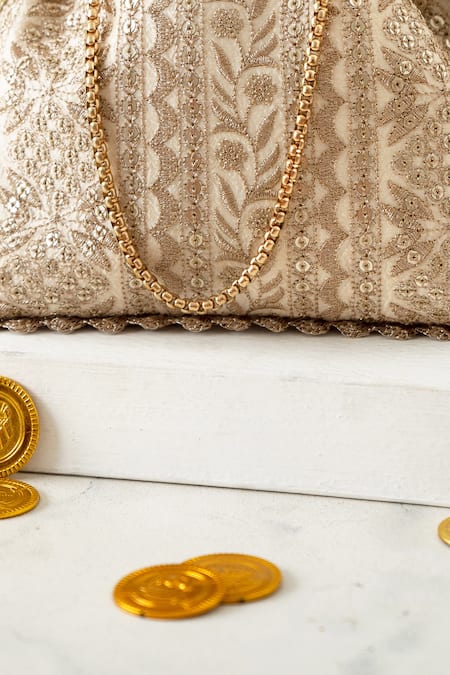 Buy Amyra Cream Embroidery, Tassels Mirai Potli Online at Aza Fashions Buy_Amyra_Cream Embroidery, Tassels Mirai Potli_Online_at_Aza_Fashions