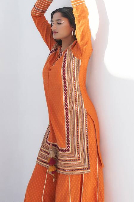 Shop Nadima Saqib Orange Chanderi, Jacquard Embroidery Split V-neck Mirror And Resham Kurta Online at Aza Fashions Shop_Nadima Saqib_Orange Chanderi, Jacquard Embroidery Split V-neck Mirror And Resham Kurta _Online_at_Aza_Fashions