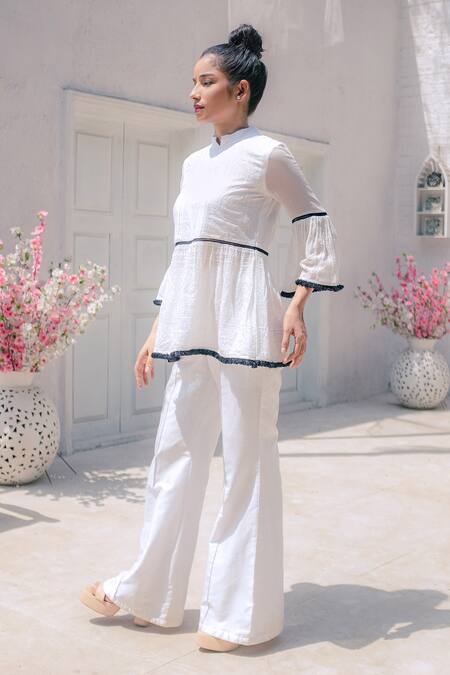 Shop Monk & Mei By Sonia Anand White Georgette Tassels Mandarin Collar Flared Top And Pant Set Online at Aza Fashions Shop_Monk & Mei By Sonia Anand_White Georgette Tassels Mandarin Collar Flared Top And Pant Set _Online_at_Aza_Fashions