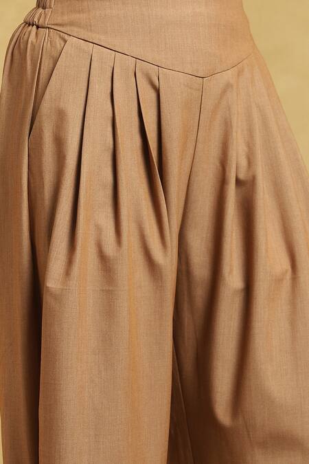Ritu Kumar_Brown Polyester, Rayon, Spandex Solid Front Pleat Dhoti Pant_at_Aza_Fashions