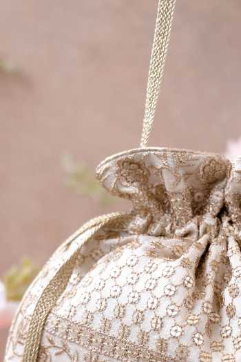 Shop_Amyra_Off White Embroidery, Tassels Floral Potli Bag _Online_at_Aza_Fashions