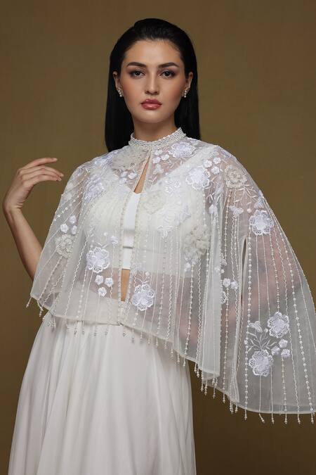 Shriya Som_Ivory Tulle, Crepe, Chiffon Pleated Lehenga And Floral Embroidered Capelet Set _Online_at_Aza_Fashions