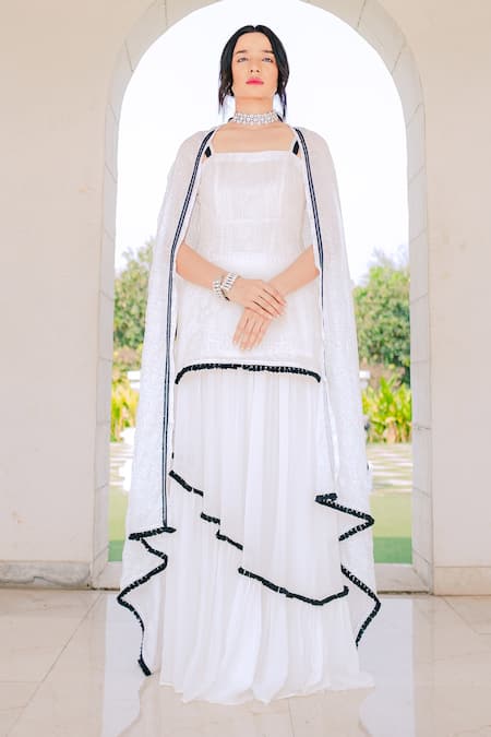 Shop Monk & Mei By Sonia Anand White Georgette Tassels, Lace Square Floral Embroidered Kurta Lehenga Skirt Set Online at Aza Fashions Shop_Monk & Mei By Sonia Anand_White Georgette Tassels, Lace Square Floral Embroidered Kurta Lehenga Skirt Set _Online_at_Aza_Fashions