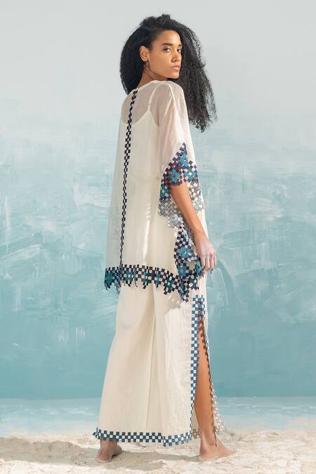 Ikai By Ragini Ahuja_Ivory Cotton, Silk Applique, Cut Work Round Neck Nile Table Mat Top_Online_at_Aza_Fashions