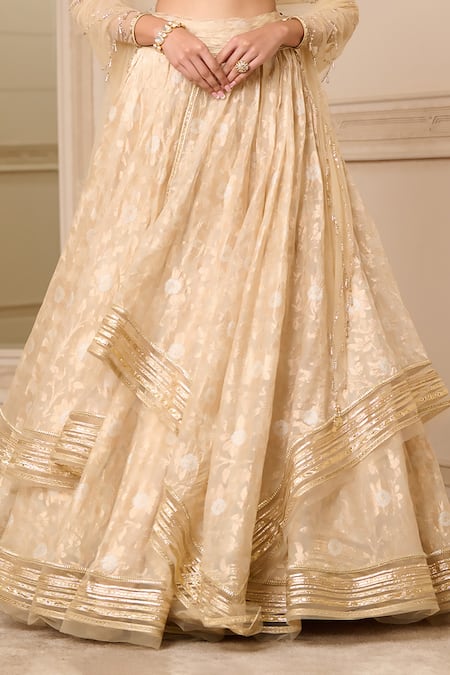 Tarun Tahiliani_Gold Georgette, Chanderi, Tulle Crystals, Gota Patti, Floral Pattern Lehenga Set_at_Aza_Fashions