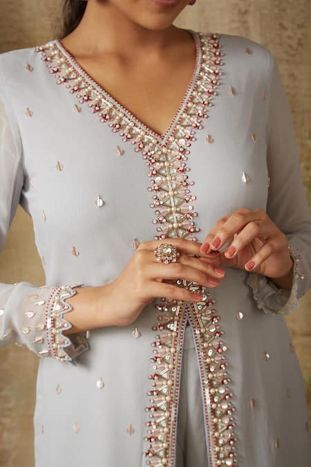 Ria Shah Label Grey Georgette Pearls, Sequins V-neck Crystal Embellished Slit Kurta With Pant Online at Aza Fashions Ria Shah Label_Grey Georgette Pearls, Sequins V-neck Crystal Embellished Slit Kurta With Pant _Online_at_Aza_Fashions