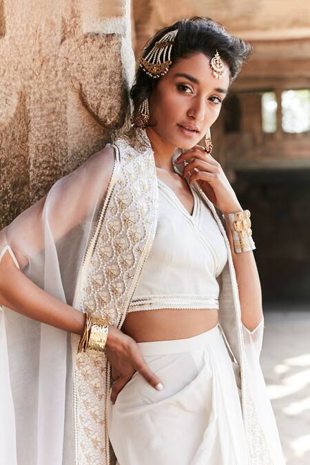 Tisha Saksena_Ivory Silk, Crepe Zari V-neck Embroidered Border Cape And Dhoti Pant Set _Online_at_Aza_Fashions