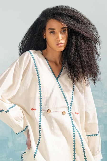 Ikai by Ragini Ahuja_Ivory Cotton Applique, Cut Work V-neck Nile Overlap Wrap Top _Online_at_Aza_Fashions