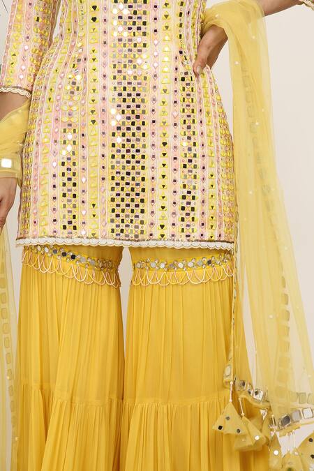 Shop_Nitisha Kashyap Official_Peach Net, Georgette, Silk Sequins, Cold Shoulder Embroidered Kurta Gharara Set _Online_at_Aza_Fashions