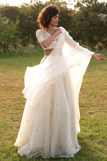 Buy Daisy white anarkali suit in georgette with lucknowi thread embroidered  kalis and mughal motifs on the border.