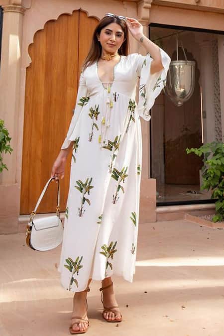 Nikasha Off White 100% Crepe Sequin, Banana Tree Print, Thread And Hand Painted Dress at Aza Fashions Nikasha_Off White 100% Crepe Sequin, Banana Tree Print, Thread And Hand Painted Dress _at_Aza_Fashions