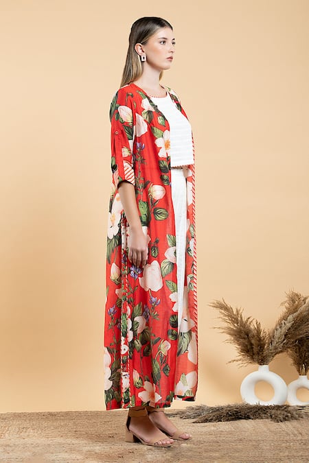 Divi By Sonal Khandelwal Red Muslin, Cotton Boat Neck Wild Rose Print Cape And White Pant Set at Aza Fashions Divi By Sonal Khandelwal_Red Muslin, Cotton Boat Neck Wild Rose Print Cape And White Pant Set _at_Aza_Fashions
