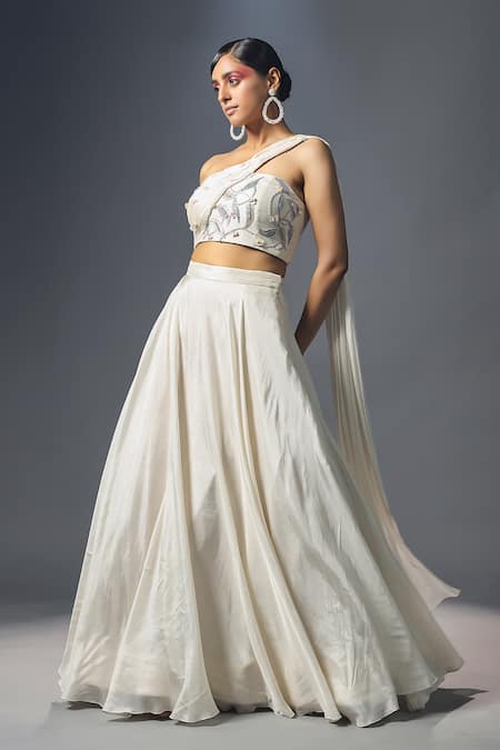 ISHA GUPTA TAYAL_White Silk And Chiffon Leaf Motifs One Shoulder Lehenga & Draped Blouse Set _Online_at_Aza_Fashions