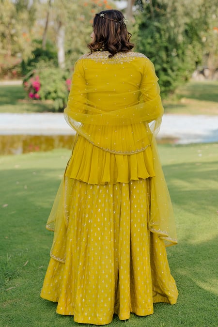 Shop_Anupraas By Nishant And Rahul_Yellow Net, Georgette, Bemberg Silk Floral Embroidered Peplum Top And Skirt Set _at_Aza_Fashions
