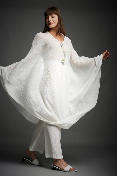 Buy Neha Gursahani White Crinkled Cotton V Neck Draped Top And Pant Set Online at Aza Fashions Buy_Neha Gursahani_White Crinkled Cotton V Neck Draped Top And Pant Set _Online_at_Aza_Fashions
