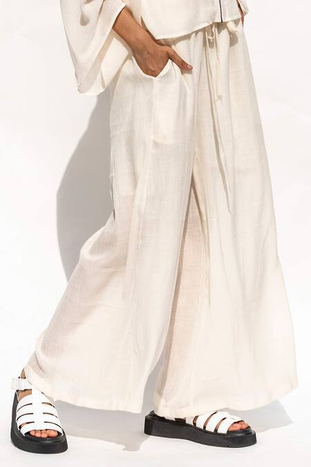 Buy Corpora Studio White High Neck Flared Pant Set Online at Aza Fashions Buy_Corpora Studio_White High Neck Flared Pant Set _Online_at_Aza_Fashions