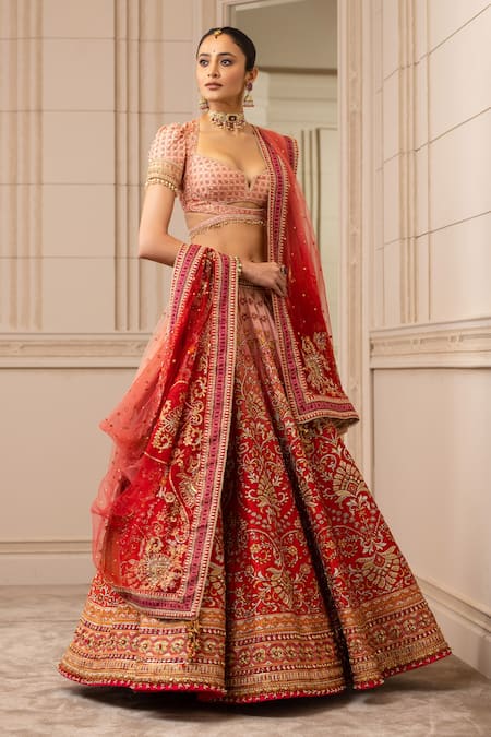 HOT PINK BANDHANI BANDHEJ LEHENGA SET WITH A MIRROR EMBROIDERED CLASSIC  BLOUSE PAIRED WITH A MATCHING DUPATTA AND GOLD DETAILS. - Seasons India