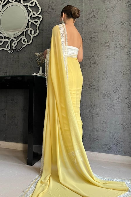 Buy Yellow Georgette Embroidered Floral Scallop Saree With Corset For Women  by Devnaagri Online at Aza Fashions.