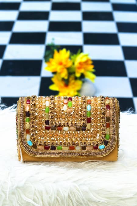 Gold studded clutch outlet bag