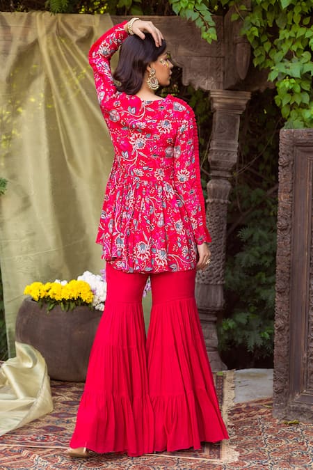 Shop Chhavvi Aggarwal Red Crepe V Neck Printed Peplum Top And Sharara Set at Aza Fashions Shop_Chhavvi Aggarwal_Red Crepe V Neck Printed Peplum Top And Sharara Set _at_Aza_Fashions