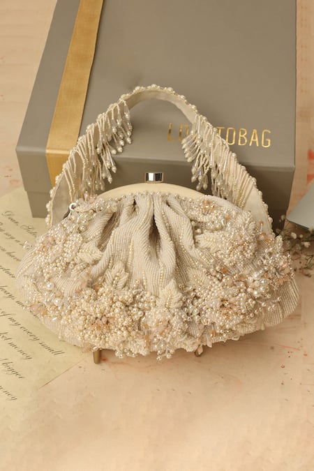Shop Lovetobag Ivory Embellished Esme Soft Pouch With Handle at Aza Fashions Shop_Lovetobag_Ivory Embellished Esme Soft Pouch With Handle _at_Aza_Fashions